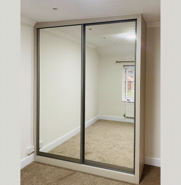 Third view of black-framed mirrored glass wardrobe doors