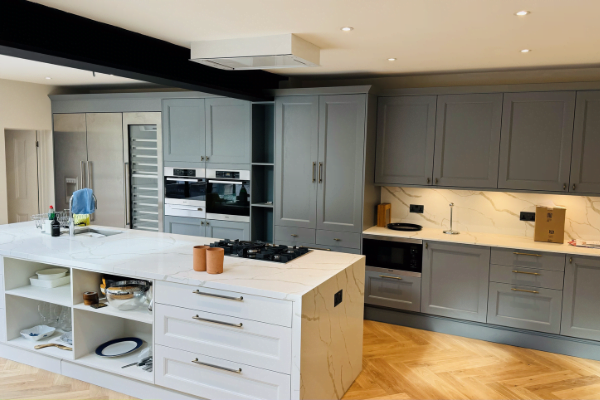 Dove-grey shaker kitchen in a Richmond period property with central island and herringbone flooring