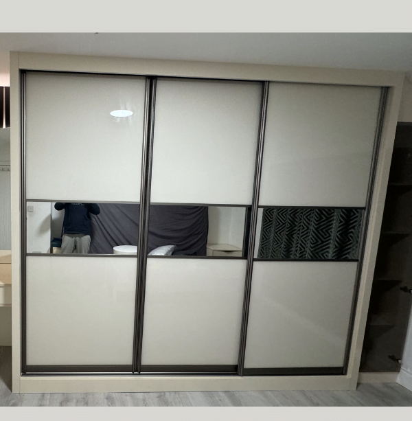 Third view of matt black sliding wardrobe with mirrored door and white interior