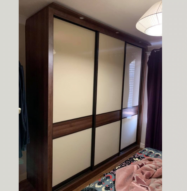 Fourth view of matt black sliding wardrobe with mirrored door and white interior