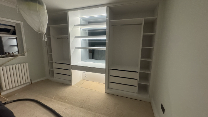 Third view of matt stone and cream hinged wardrobe with black-framed doors