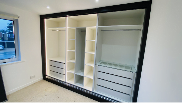 Fourth view of matt stone and cream hinged wardrobe with black-framed doors