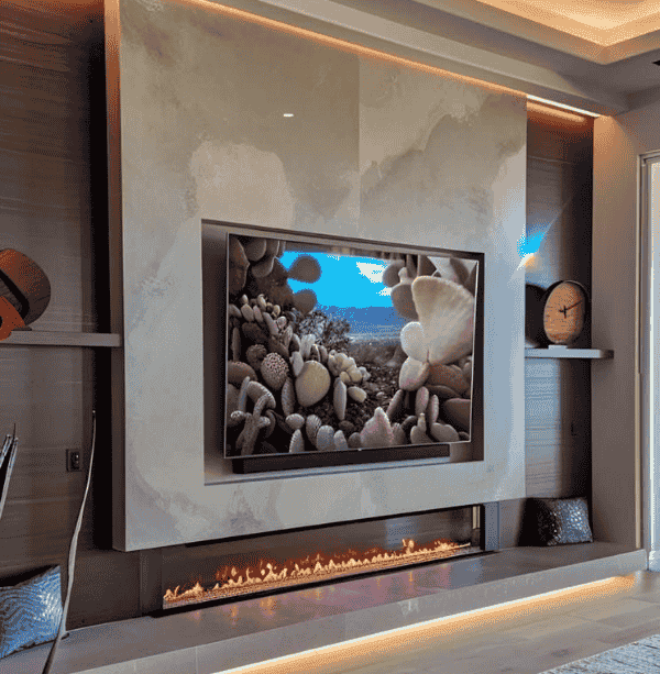 Statement marble media wall with extra-wide electric fire and built-in shelving in a premium UK lounge
