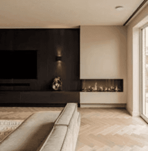 Luxury fitted media wall with dark wood panelling and corner fireplace in a modern UK home
