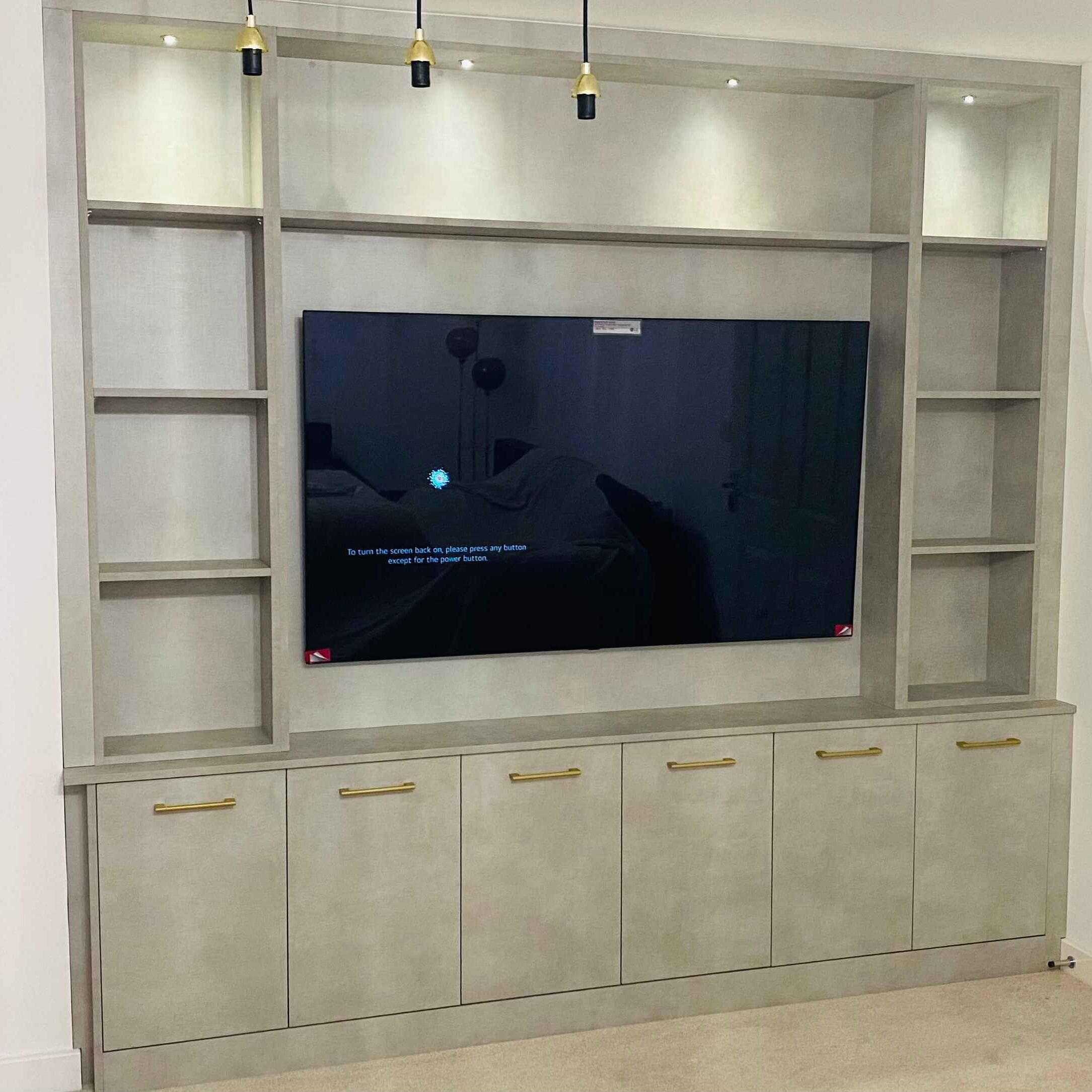 Grey media wall with display shelving and storage, fitted in Newbury